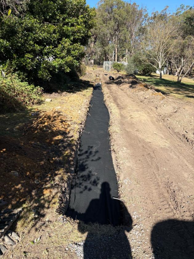 Excavated soakage trench on a rural septic replacement, Bega Valley