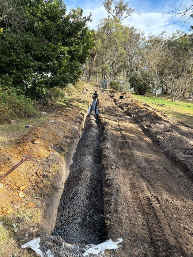 New gravity soakage trench during backfill, Kanoona
