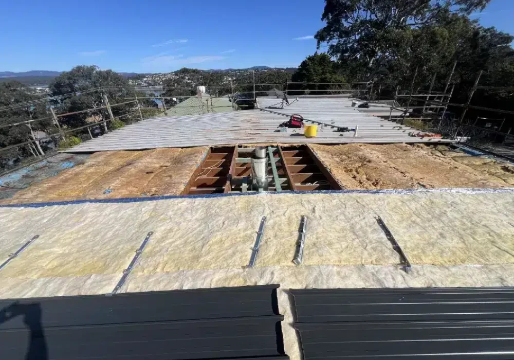 Roof plumbing in progress by the local eden team